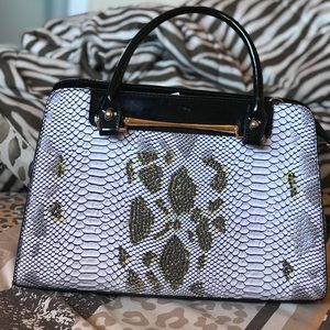 A hand bag with alot of space inside